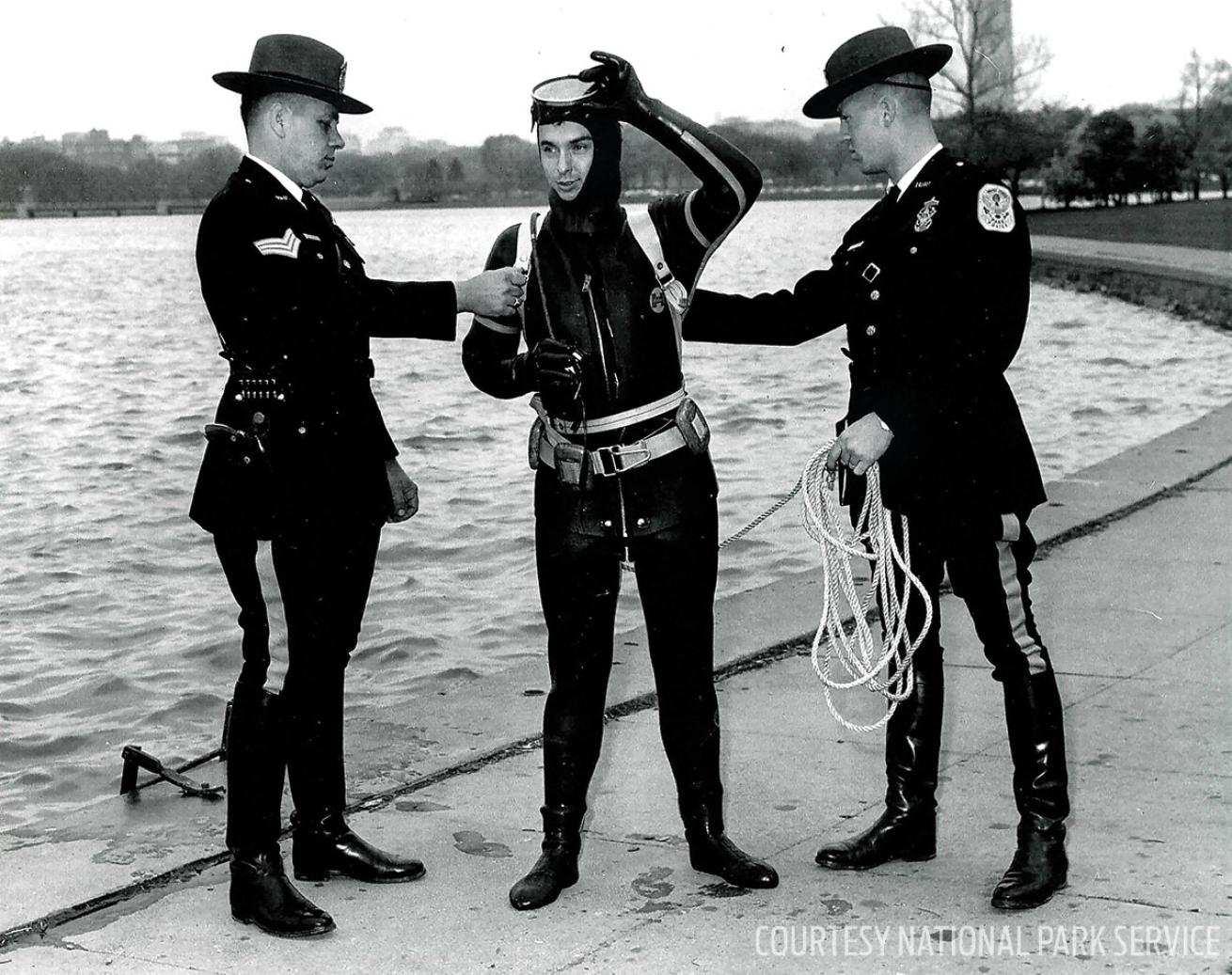 Park rangers scuba diving in the Tidal Basin, Washington D.C.