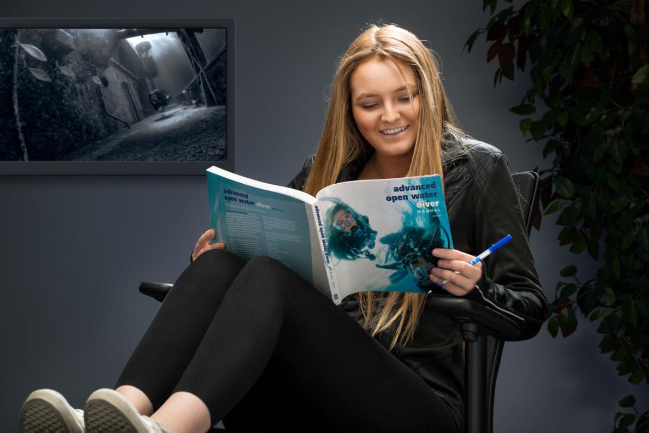 Diver Studying PADI Books