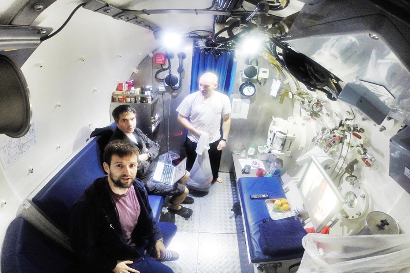 Saturation divers in an diving support vessel.