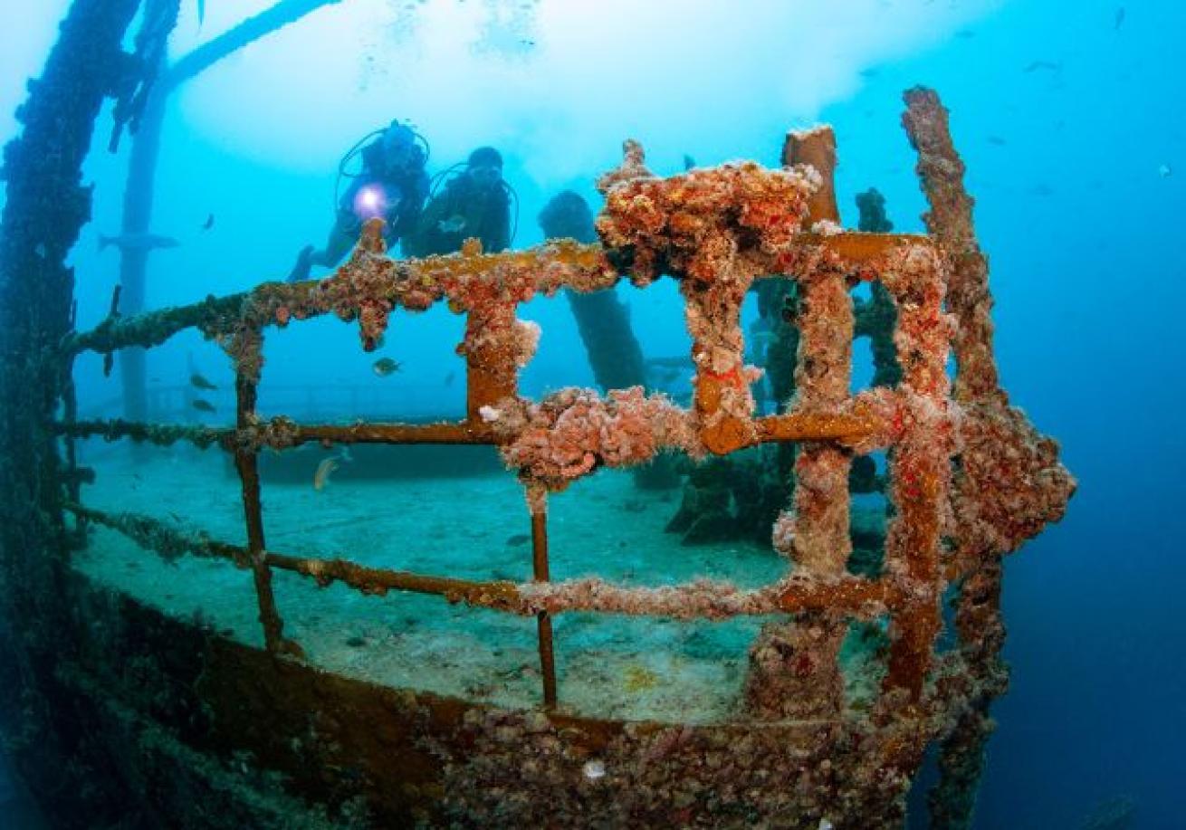 Scuba divers on a shipwreck