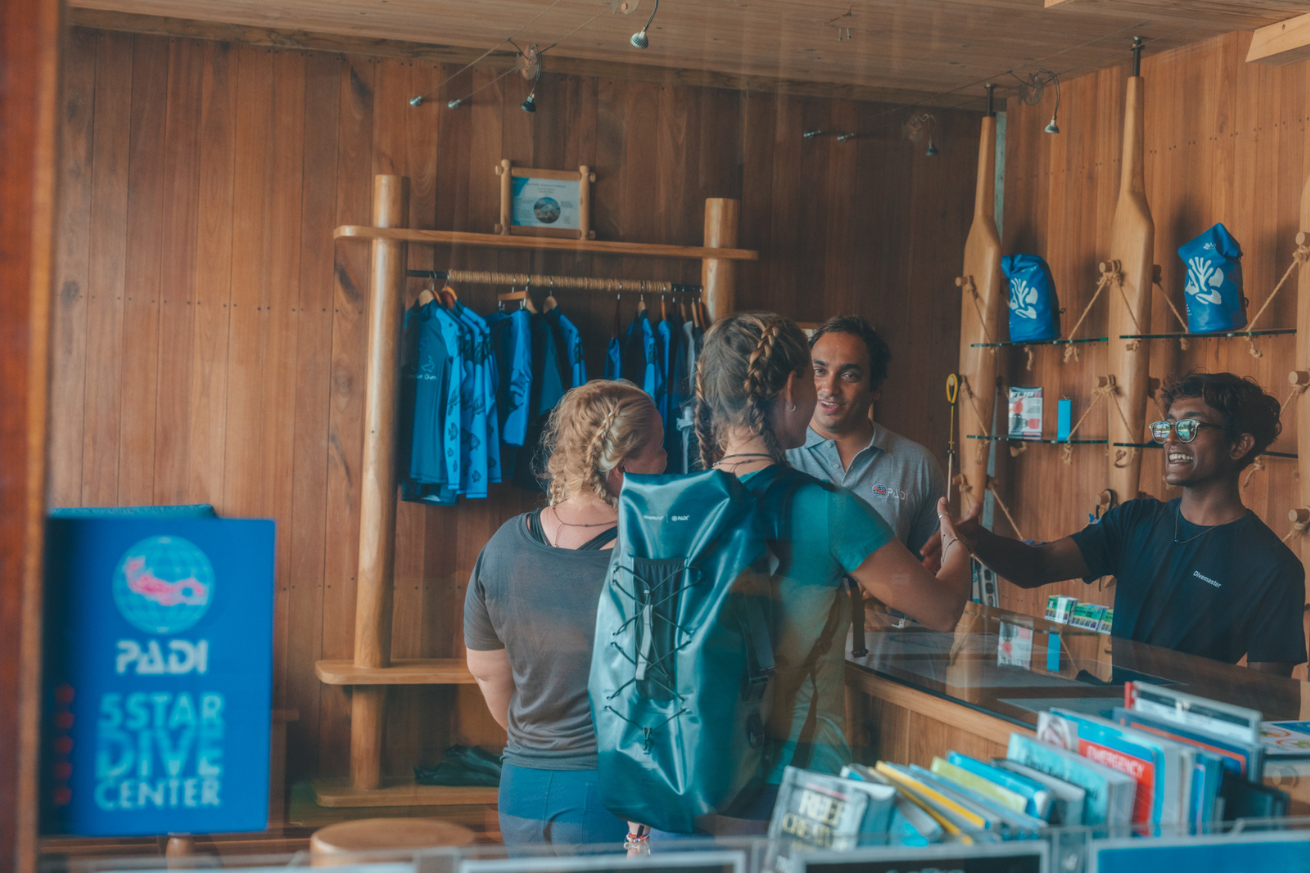 A group of people in a dive store